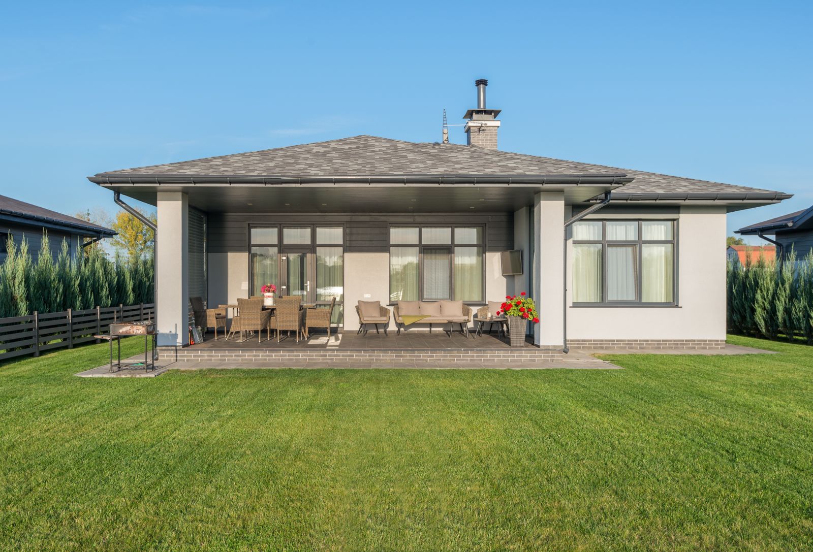 Contemporary home with a large landscaped backyard and patio